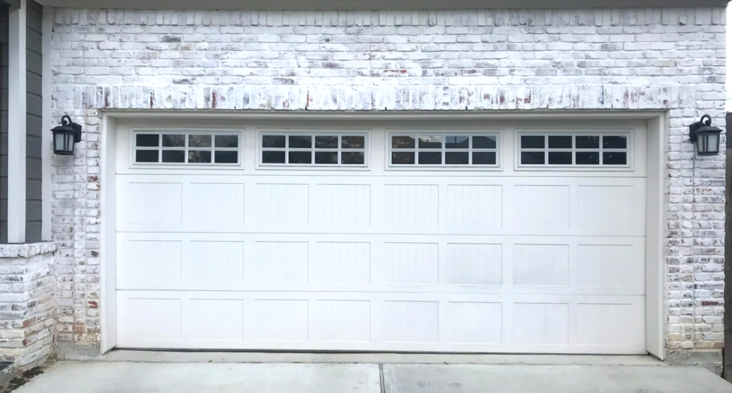 Professional technician repairing a custom garage door with unique design, ensuring proper function and security for Westerville Garage Door Repair.