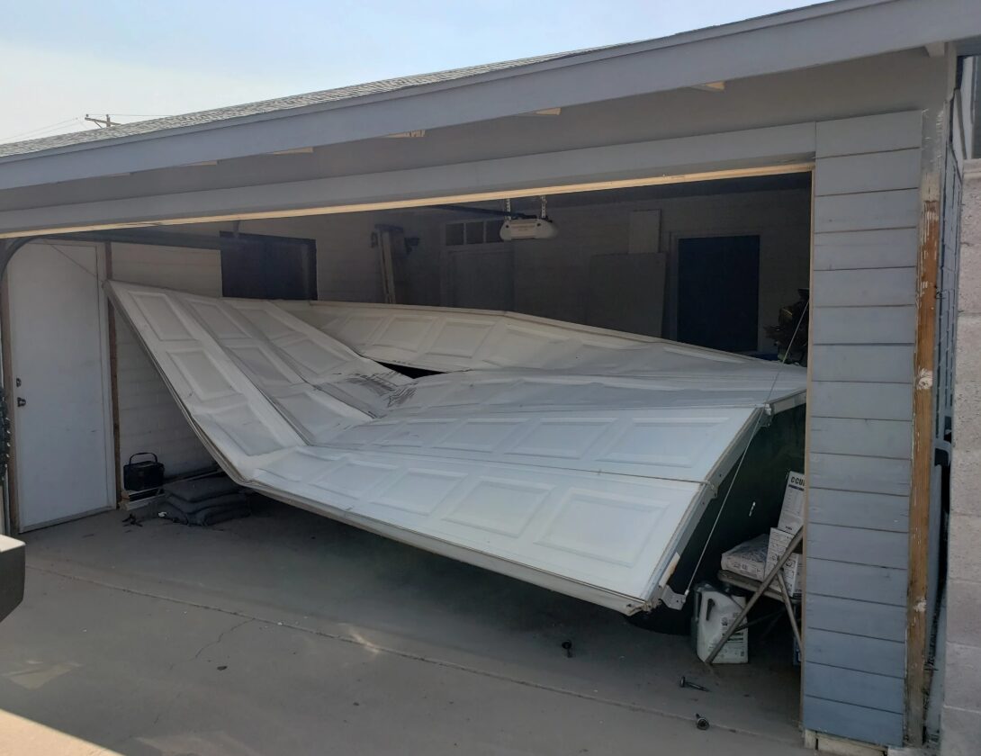 Emergency garage door repair service in Westerville, showcasing a professional technician fixing a residential garage door, highlighting reliability and expertise in fast repair solutions